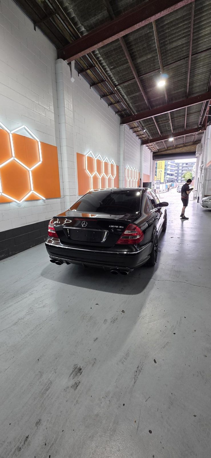 Rear of a freshly detailed black Mercedes-AMG